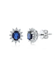 14K White gold earrings with 0.75 carat Blue Sapphire and 0.06 White Diamonds